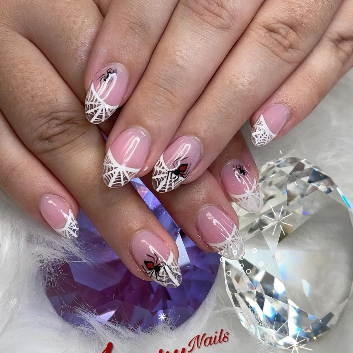 Soft pink nails with crystal accents