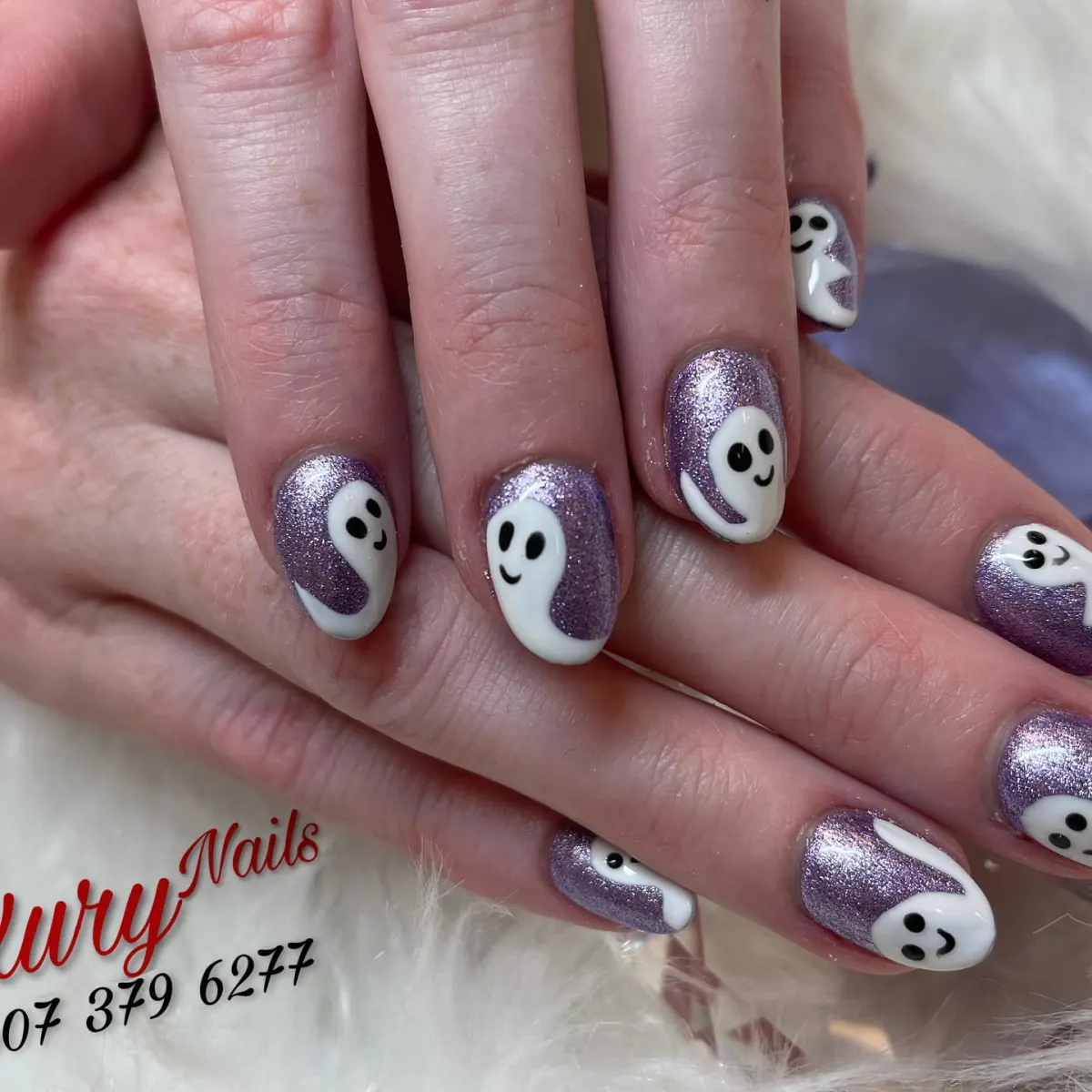 White ghost nail art with silver accent nails