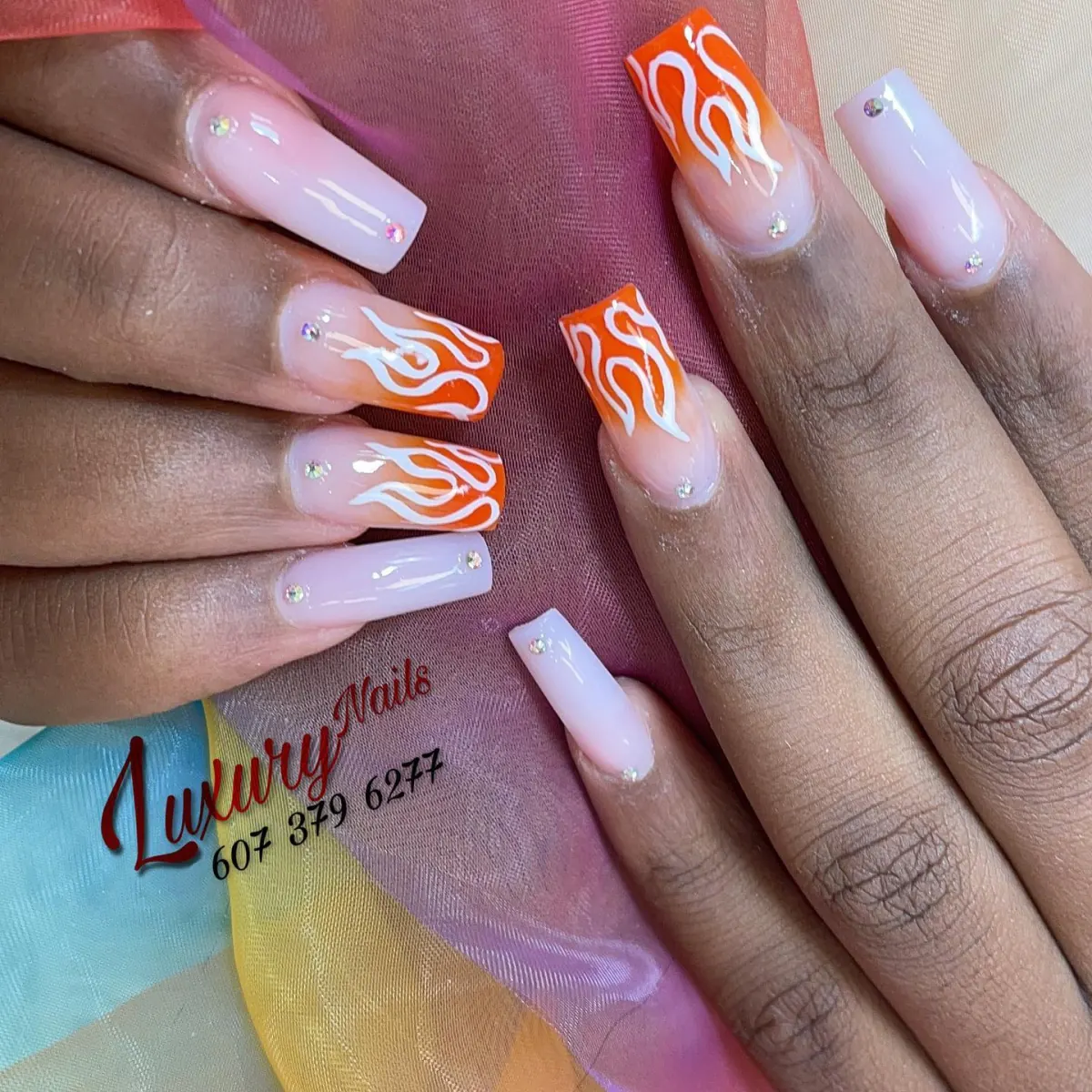 Orange flame nail art with pale tips